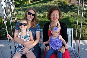 Moms and daughters on the family swing at Smale Park