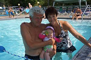 Now that's a swimming pool. Capri with her Grandpa and Grammy