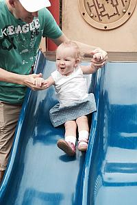 At New Orleans City Park - Capri enjoying the slide :)