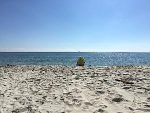 At the beach - Grandpa is hanging out at the water's edge. 