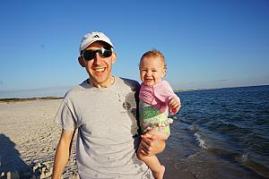 Daddy and Capri walking along the water