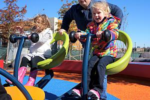 Cardin riding on a futuristic see saw