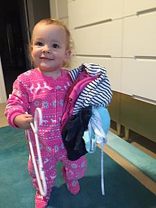 Capri helping Mom with the laundry.