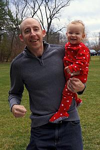 Dad running with Capri in the backyard - she loves when we run around.