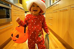 Running around the house wearing the Christmas hat and carrying her blankie and the pumpkin. That makes perfect sense!
