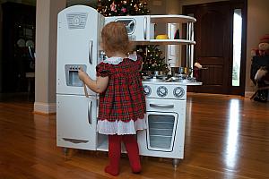 Playing with her new kitchen set!