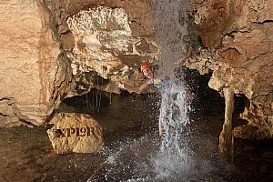 Walking our way back out of the cave -- waterfall!