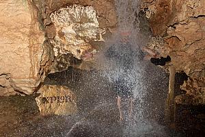 Walking our way back out of the cave -- waterfall!