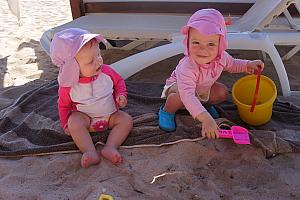 And Capri and Kenley are having fun playing in the sand