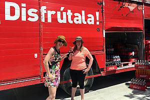 Kelly and Kyleen were amused to pose with their glass bottle Coca Colas in front of the Coca Cola delivery truck