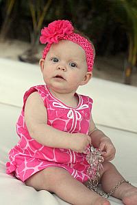 Kenley playing on the beach bed