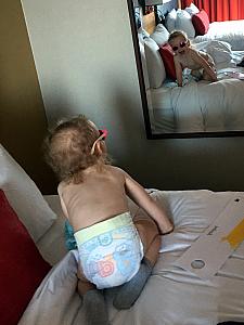 Capri having fun with the mirror at the hotel