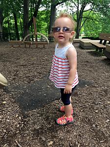 Wearing Mommy's sunglasses at the playground