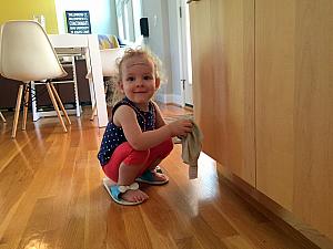 Wearing mommy's sandals - and sporting a stylish bandaid on her forehead, due to a good scratch after wiping out on the sidewalk