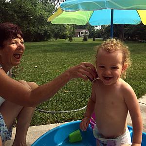 Capri and Mimi in our backyard pool