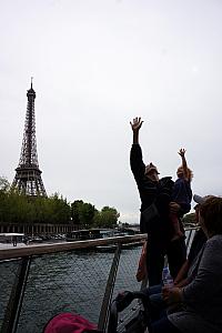 On a boat tour of the Seine River -- Jay and Capri reaching for the sky (well, really, a bridge that we were passing under, you just can't see that)