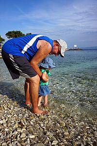 Papa and Capri dipping their toes in the water