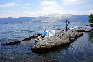 Jay relaxing on a lounge chair in shallow water