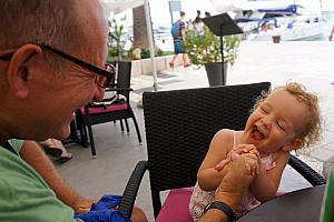 Capri and Papa arm wrestling