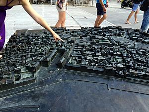 Kelly pointing to our apartment in the model of the old town.