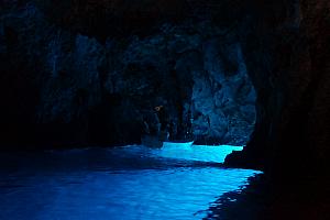 Inside the Blue Cave -- there's a hole below the water level -- sunlight reflects off the bottom of the sea into the cave.