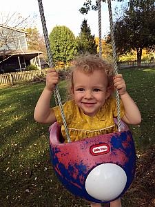 Swinging in Benny and Cooper's tree swing