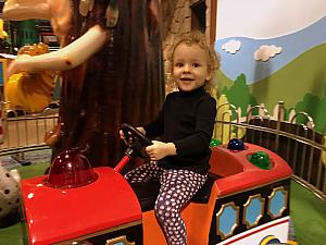 Riding a toy train ride