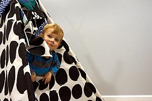 Thomas playing in the tent