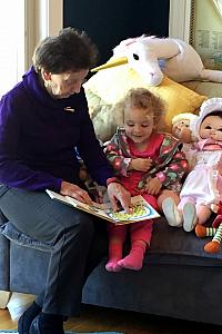 Aunt Christina reading a story to Capri