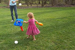 And of course the tee goes flying :) It's still a little tall for her.