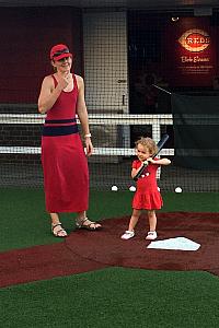 At the Reds game - Capri is at the bat! They have a great wiffle ball field at the ballpark.