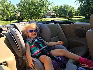 Capri taking a convertible ride to the swim club =)