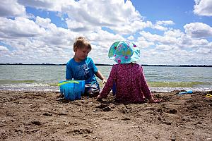 Cooper and Capri playing in the sand