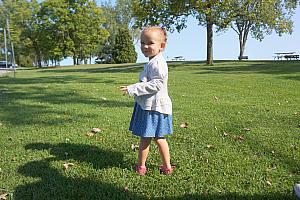 Capri pausing for a smile in a field.