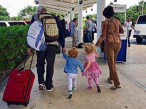 November 11: Landed in Cancun. Grandpa and Mimi are escorting the girls to our van.