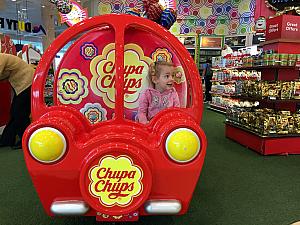 Capri says this is her favorite photo -- of her playing in the Chupa Chups car at the airport. Ha.