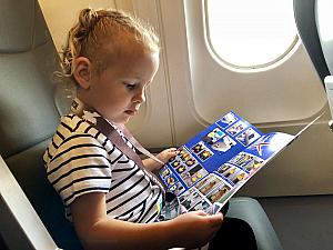 Every time we board a plane, the first thing Capri wants to do is read the safety manual ;) Or look at the illustrations and have us explain them to her, at least.