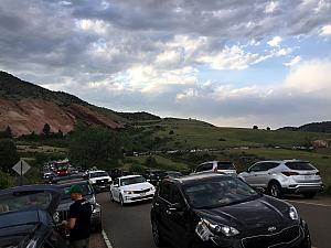 Line of cars to get into Red Rocks -- cars parallel parked all the way up this road (we did too)!