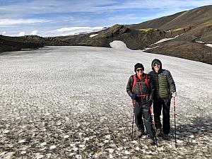 The snowfields are streaked with volcanic ash