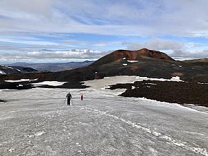 Hiking over more snow fields, preparing to ascend Magni crater and mountain (the highest point in front of us). You can see yellow poles in the distance on the mountain marking our trail. We would've been lost without them. I can't image doing this hike with low visibility.