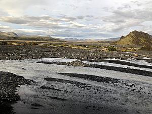The bus had fortified suspension and raised wheel beds so that it could surpass very rocky terrain and travel through creeks like this.
