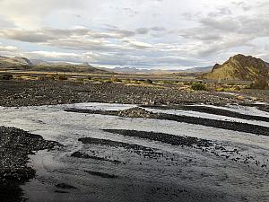 The bus had fortified suspension and raised wheel beds so that it could surpass very rocky terrain and travel through creeks like this.