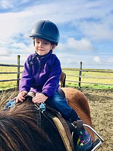 We had beautiful weather for our first family horse ride.  in Hella, Iceland.