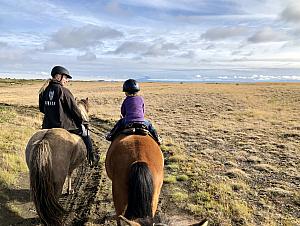 Capri riding with our guide, Simone. Mt. Hekla is visible in the distance. Hekla is one of Iceland's most active volcanoes; over 20 eruptions have occurred in and around the volcano since 874. During the Middle Ages, Europeans called the volcano the "Gateway to Hell"