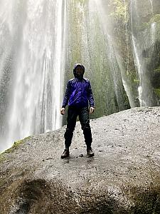 Gljfrabi waterfall is a small waterfall north of the larger falls of Seljalandsfoss. The falls are partially obscured by the cliff rock, but hikers can follow a trail to enter the narrow canyon and hop along river rocks to where the water plummets to a small pool.