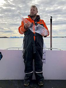 Our fearless guide holding a block of ice