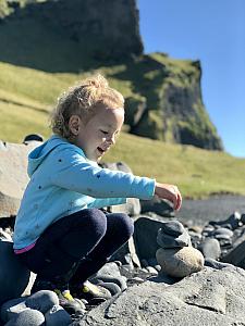 Capri playing at Black Sand Beach. This was our last day in Iceland. We planned several stops, but ended up spending the entire afternoon at the beach instead. The weather was perfect and Capri was having a blast climbing and playing in the sand and rocks.